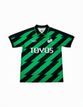 Green and black striped polo shirt with 'TOYOS' branding on a white background